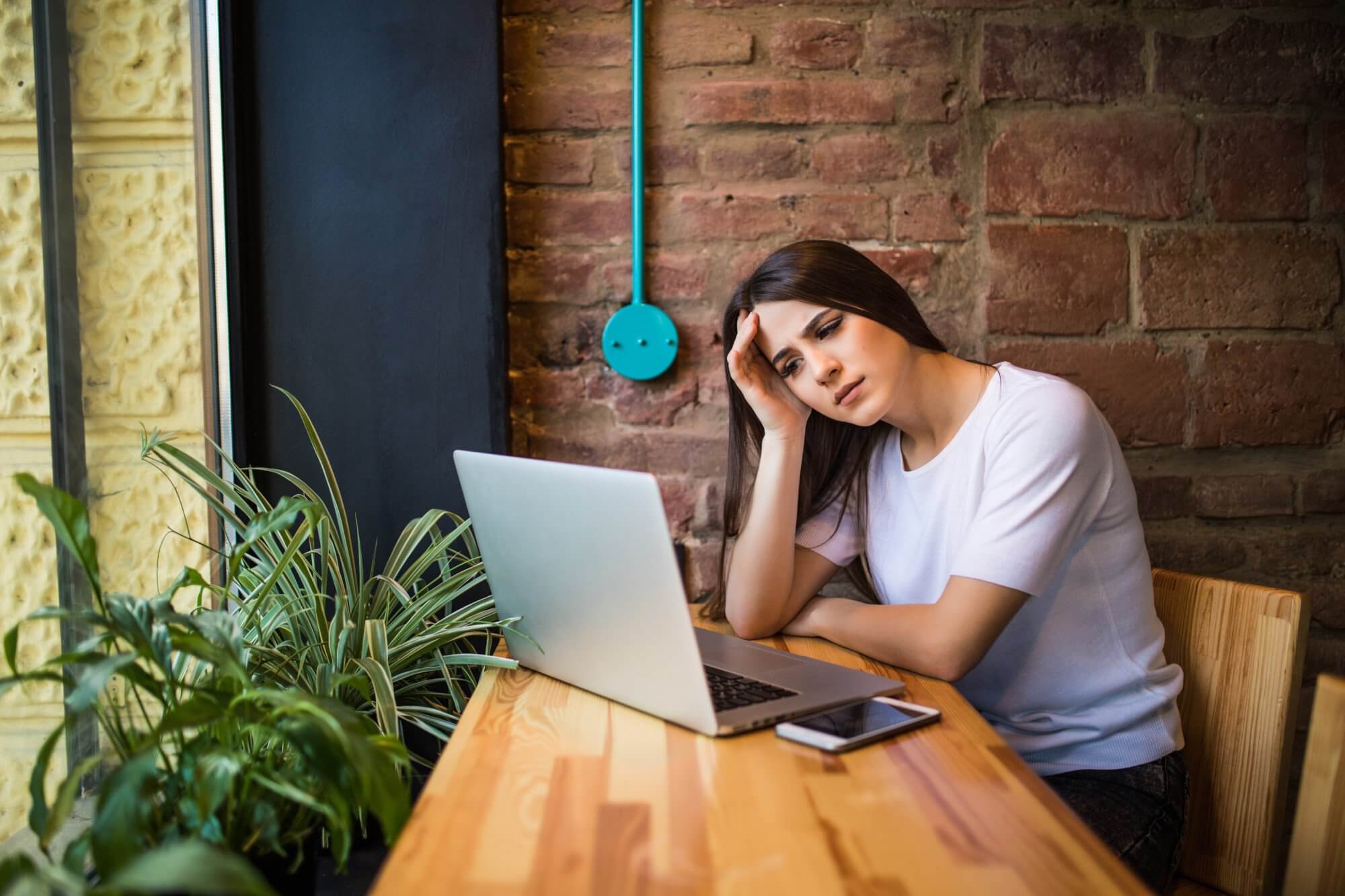 Worried Woman Holding Computer