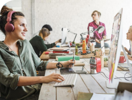 Woman Working At Computer In Office