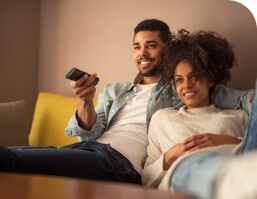 Young Couple Watching Tv Together