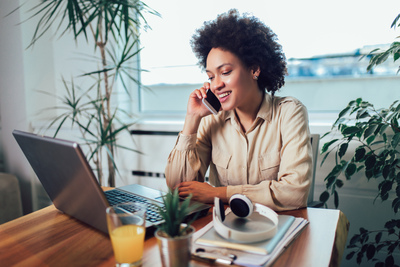 Entrepreneur Sitting At A Desk In Home Office Working Online.jpg